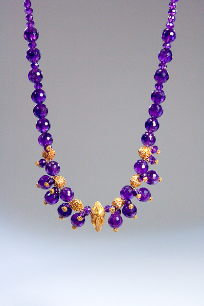 Lovely faceted 10mm amethyst beads with 18k gold accents.     $1200