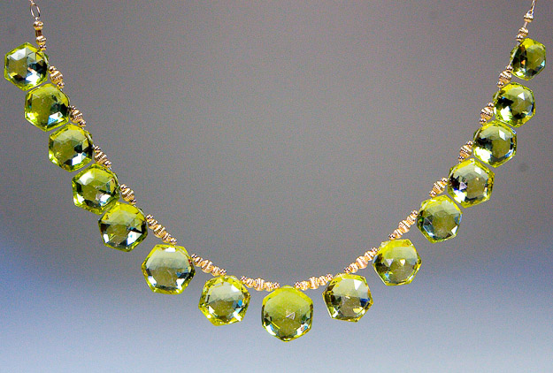 Green gold citring with 14k gold accents, chain, and clasp    $695