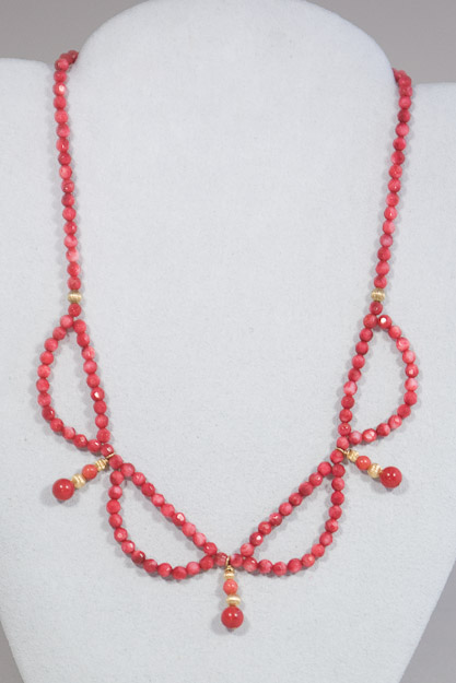 Faceted red coral beads with 14k gold accents $150